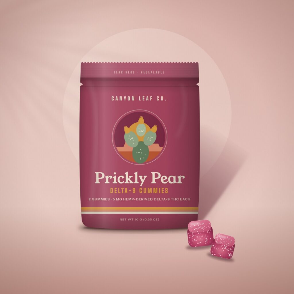 Prickly Pear Delta-9 Gummies in a magenta resealable pouch with two sugar-dusted gummies